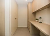 Thumbnail 11 of 19 - a small bathroom with a long counter and a door