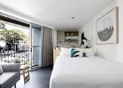 Thumbnail 13 of 13 - a hotel room with a bed and a balcony