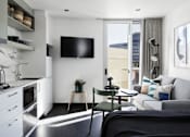 Thumbnail 7 of 13 - a living room with a couch and a table