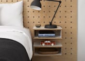 Thumbnail 3 of 13 - a bed with a wooden headboard and a shelf with a lamp and a clock