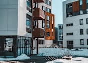 Thumbnail 3 of 4 - a group of modern buildings in the snow