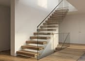 Thumbnail 11 of 11 - A wooden staircase with a glass railing.