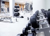Thumbnail 6 of 10 - Exercising equipment in gym