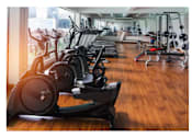 Thumbnail 1 of 11 - Rows of stationary bike and exercise equipment for bodybuilding in gym modern fitness center room