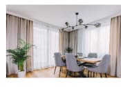 Thumbnail 6 of 11 - Dining room with wooden table and wooden floor