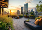 Thumbnail 5 of 20 - A rooftop patio with a couch and pillows overlooking a city skyline at sunset at Bluebell Ridge in Denver, CO