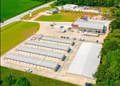 Thumbnail 1 of 6 - an aerial view of several buildings and a parking lot