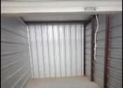 Thumbnail 12 of 22 - the inside of a garage with a concrete floor
