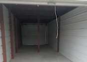 Thumbnail 14 of 22 - the inside of a garage with a white floor