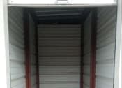 Thumbnail 7 of 9 - the inside of a small closet with white flooring and white walls