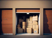 Thumbnail 9 of 9 - A storage unit with boxes piled up in the doorway.