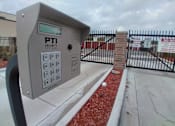 Thumbnail 1 of 9 - A grey parking meter with the number 123 on it.
