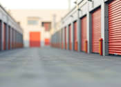 Thumbnail 8 of 9 - A long corridor with red doors on both sides.
