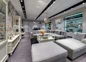 Thumbnail 8 of 10 - A modern furniture store with a variety of seating options.