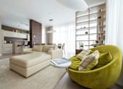 Thumbnail 5 of 10 - A modern living room with a green chair and a white couch.