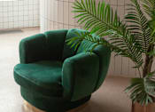 Thumbnail 3 of 21 - A green chair is in front of a tiled wall.