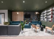 Thumbnail 7 of 20 - a living room with green walls and blue couches and chairs