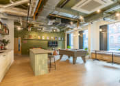Thumbnail 3 of 35 - a game room with a pool table and a bar
