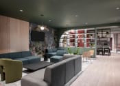 Thumbnail 8 of 20 - a lobby with couches and chairs and a table and a tv