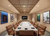 Thumbnail 4 of 26 - A conference room with a long table and chairs.