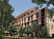 Thumbnail 7 of 26 - A modern building with a lot of windows and trees in front.