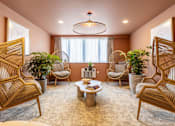 Thumbnail 1 of 65 - A living room with a round table and four chairs.