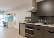 Thumbnail 9 of 21 - a kitchen with a lot of cabinets and a sink