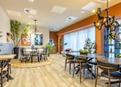 Thumbnail 8 of 35 - A dining room with a round table and chairs.