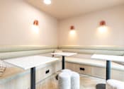 Thumbnail 7 of 25 - A room with a white table and two chairs.