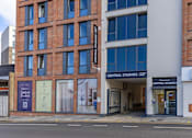 Thumbnail 39 of 41 - A building with a sign that says Central Studios.