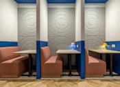 Thumbnail 8 of 41 - A dining area with a table and chairs.