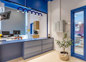 Thumbnail 16 of 41 - A reception area with a blue and white color scheme.