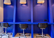 Thumbnail 24 of 51 - Three chairs are placed in front of a blue wall.