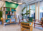 Thumbnail 20 of 51 - A room with a green wall and a wooden bookshelf.