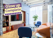 Thumbnail 1 of 41 - A living room with a sign that says "Glow up Complete".
