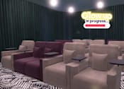 Thumbnail 8 of 21 - A row of beige chairs with a neon sign that says "Glow up in progress...".