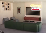 Thumbnail 6 of 21 - A living room with a green sofa and a neon sign that says "Glow up in progress...".