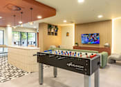 Thumbnail 5 of 49 - A foosball table with the word evolution written on it.