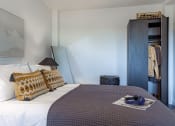 Thumbnail 3 of 37 - a bedroom with a bed and a closet