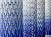 Thumbnail 2 of 37 - a close up of a wall of blue and white tiles