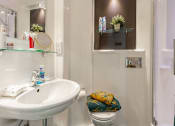 Thumbnail 21 of 39 - a bathroom with a sink toilet and shower