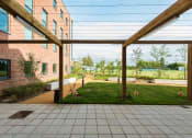 Thumbnail 35 of 39 - a view of the lawn from under the pergola