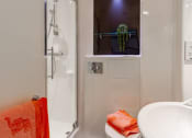 Thumbnail 31 of 39 - a bathroom with a shower and a sink