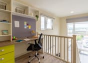 Thumbnail 41 of 50 - a home office with a desk and a chair