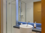 Thumbnail 15 of 50 - a bathroom with a sink and a shower
