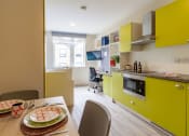 Thumbnail 33 of 50 - a kitchen and dining area in a room
