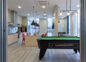 Thumbnail 2 of 50 - a games room with a pool table and a bar