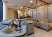 Thumbnail 3 of 50 - a seating area with couches and chairs