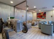 Thumbnail 4 of 50 - a vintage tractor sits in the middle of a room with couches and chairs