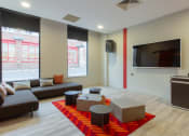 Thumbnail 5 of 50 - a living room with couches and a tv